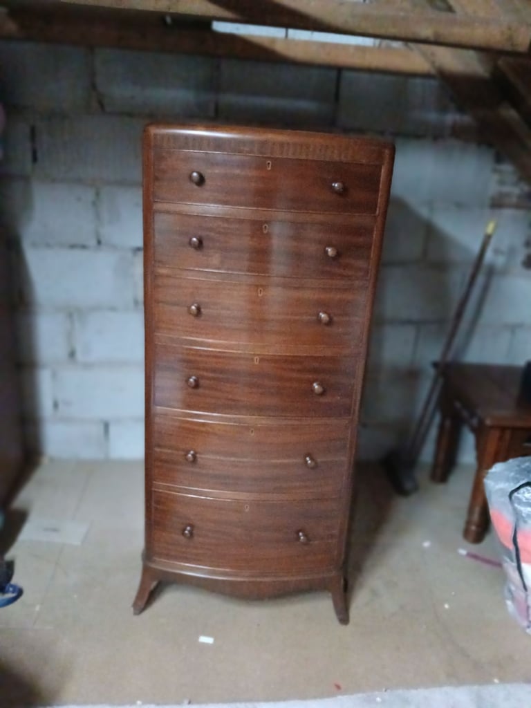 image for Tall dark wood chest of drawers. 