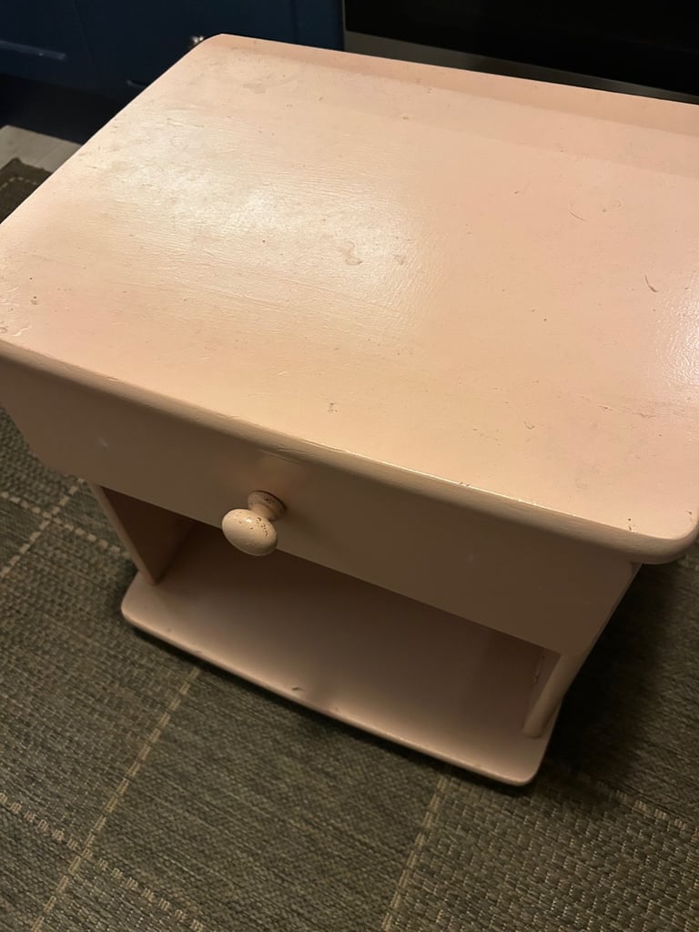 Pink beside table. Free.