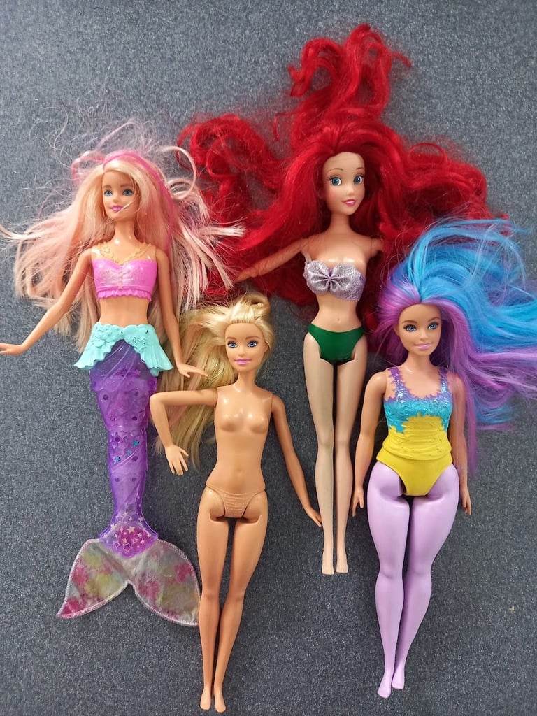 4 Dolls. 2 Barbie & 2 Disney