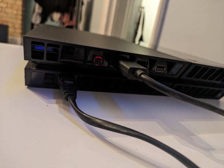 PlayStation 4 console and two controllers 