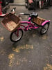 Pink tricycle with twin baskets 