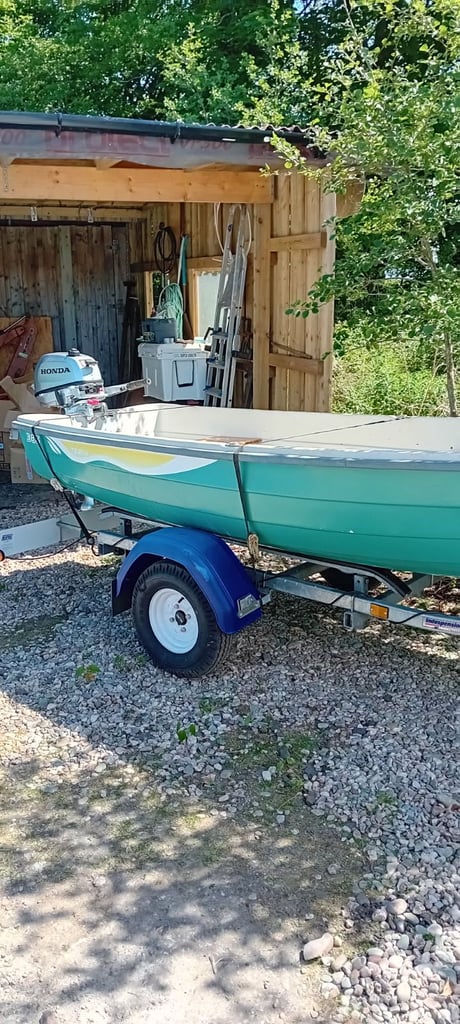 12ft fibreglass boat with 6hp Honda engine (like new) and galvanised indespension trailer (new)
