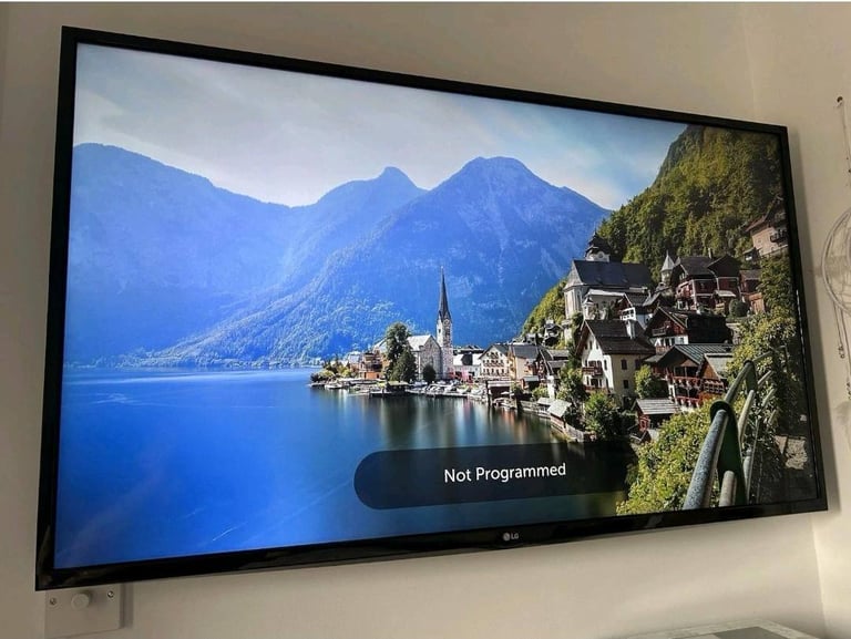 47 inch LG tv with brand news android stick and remote.