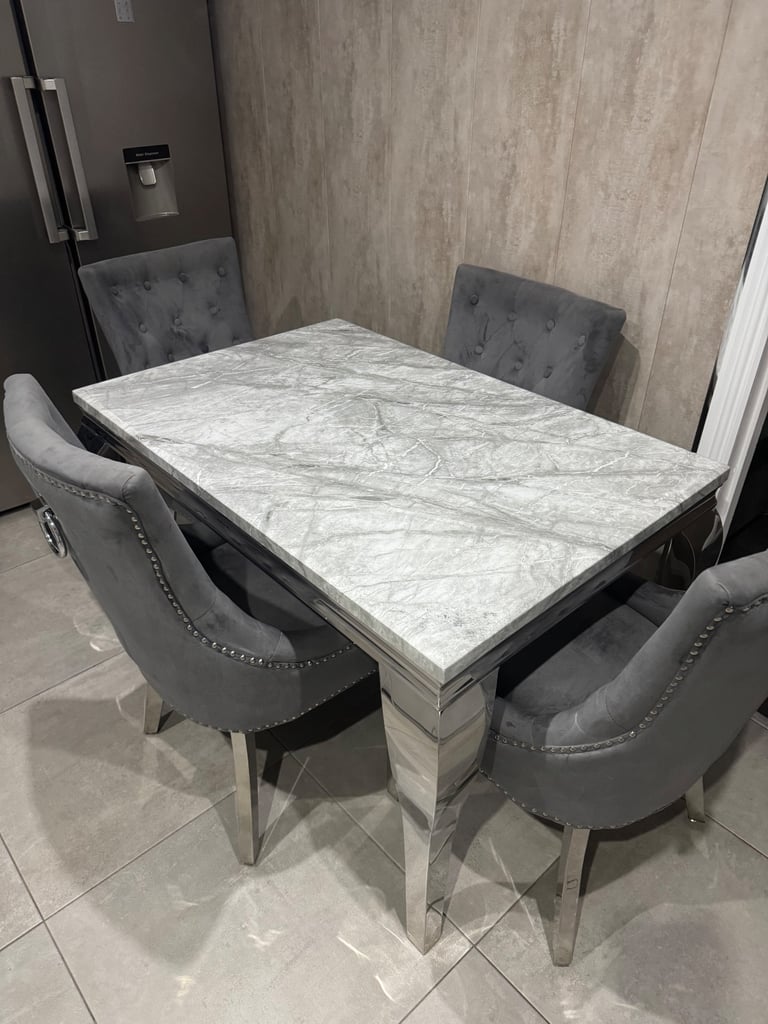 Marble table and 4 grey knocker chairs