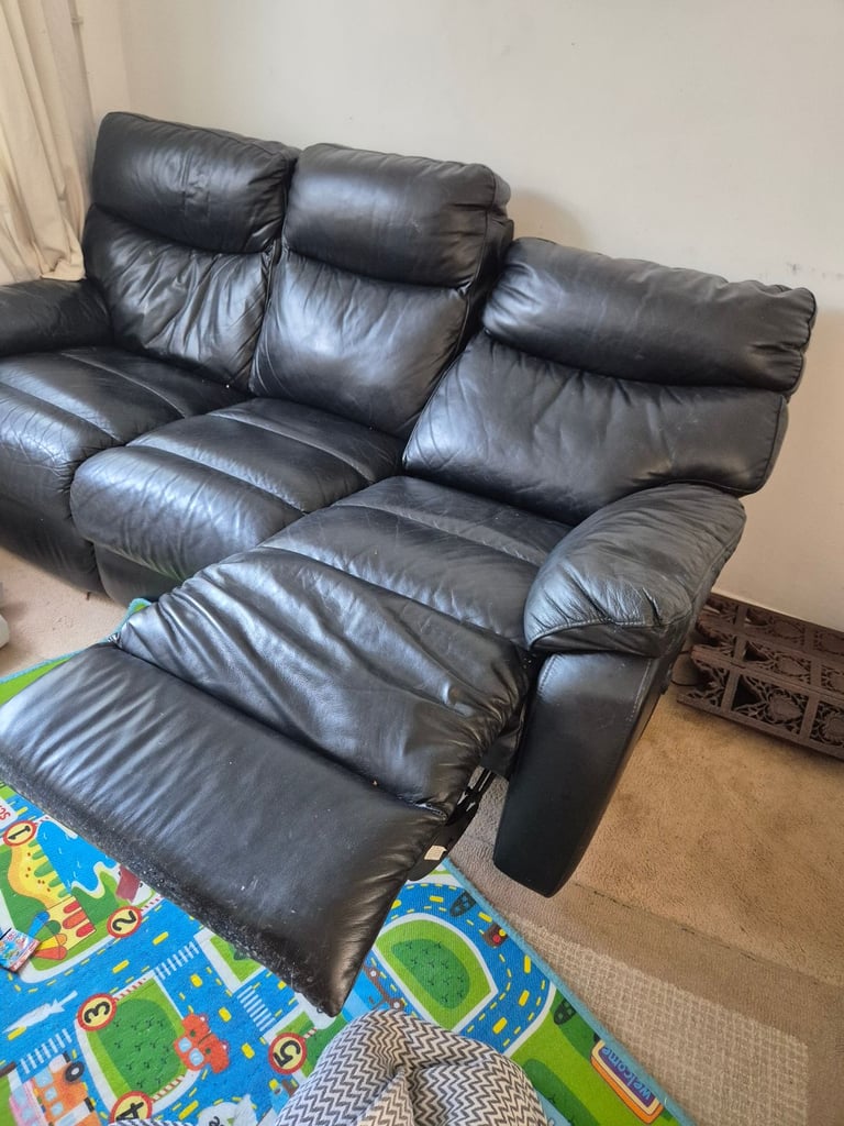 Black leather reclining 3 seater sofa 
