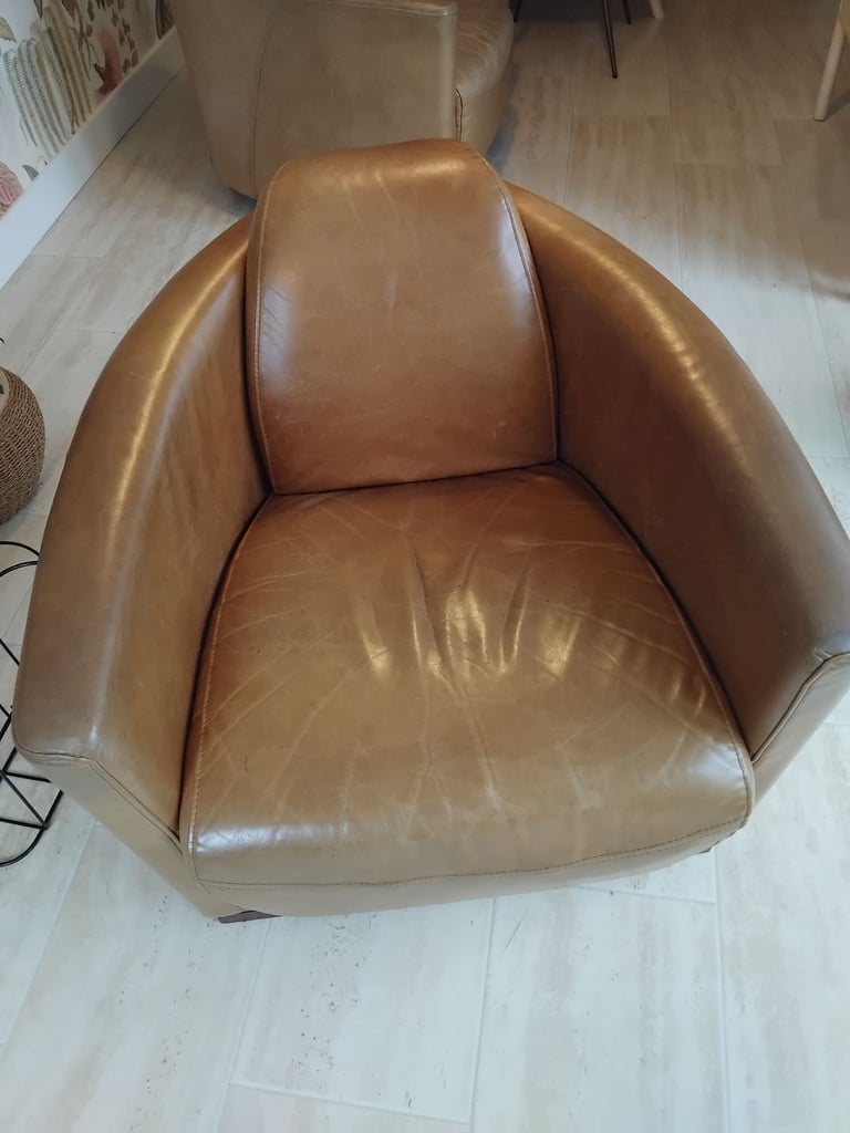 Pair of Halo Rocket/Aviator chairs in Old Saddle Nut leather. Two chairs.