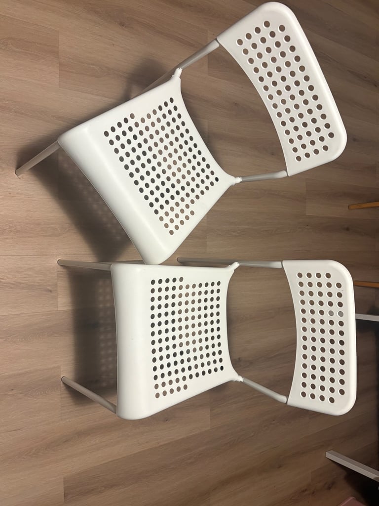 2 White Plastic Chairs
