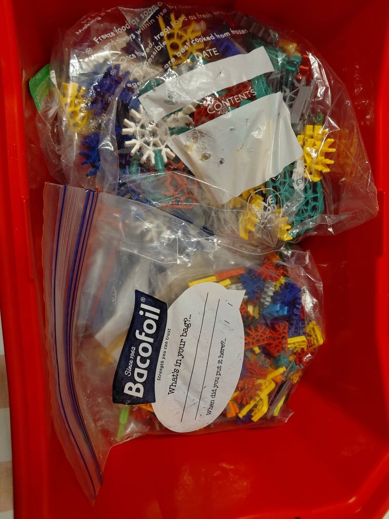 K'Nex box full of sorted pieces in strong red K'nex box with lid & motor