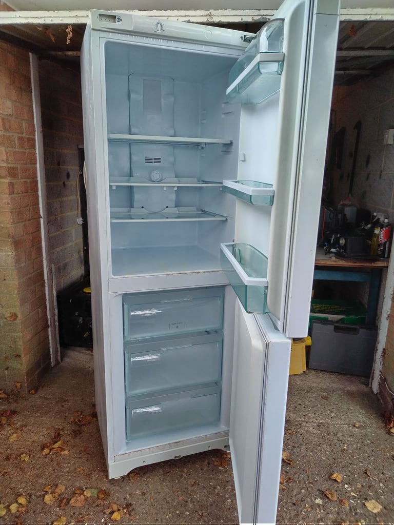 image for Hotpoint Fridge freezer 5ft x 9 inch high has couple of marks but all working can deliver local 