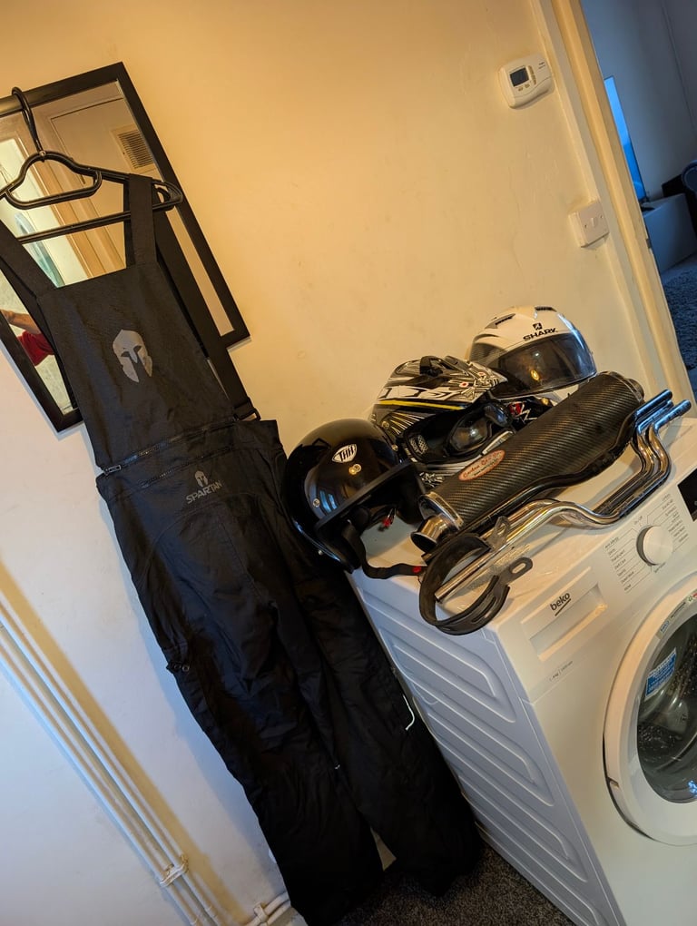 image for Job lot of Motor bike parts, clothes and 3 helmets. 