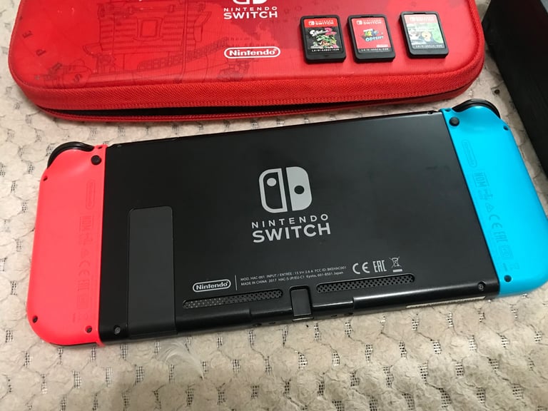 Nintendo Switch console with 3 games