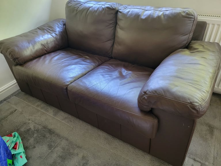image for Small brown leather sofa- free