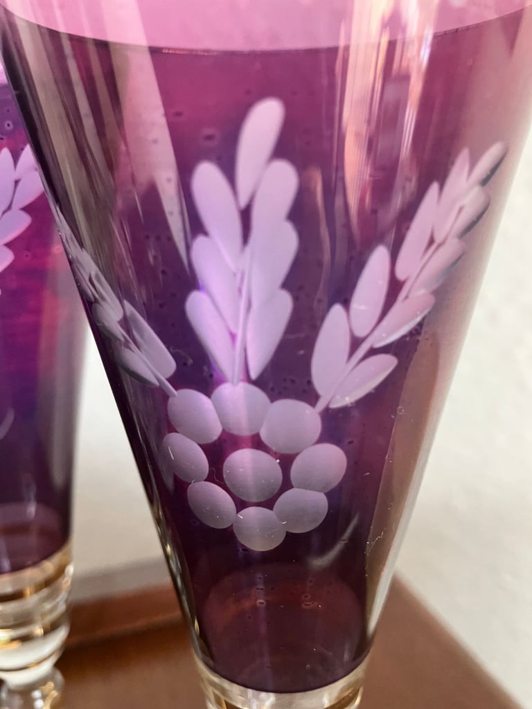 Heavy glass decanter and six vintage wine glasses.