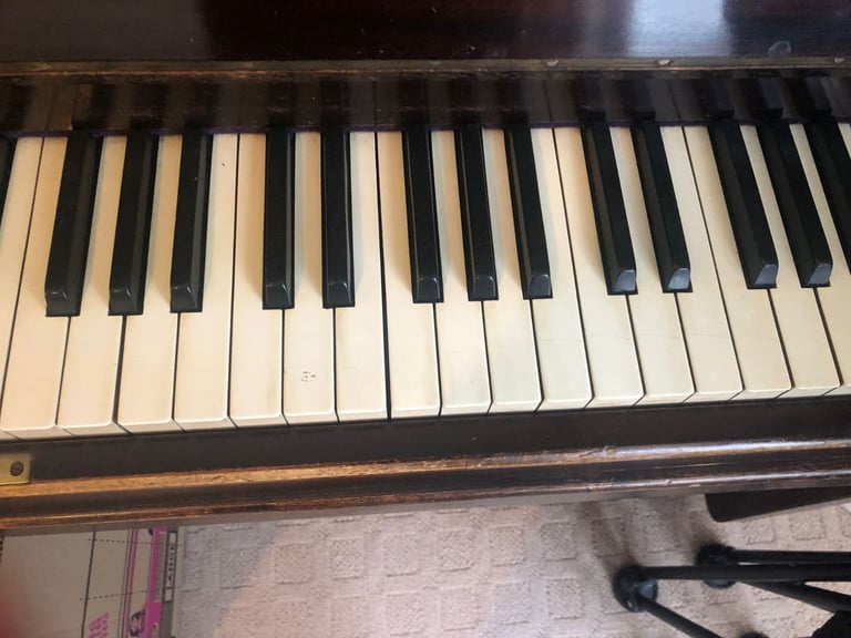 Upright Piano by Stanley Brinsmead London, 7 Octaves, 88 keys, dark wood.  Good condition.