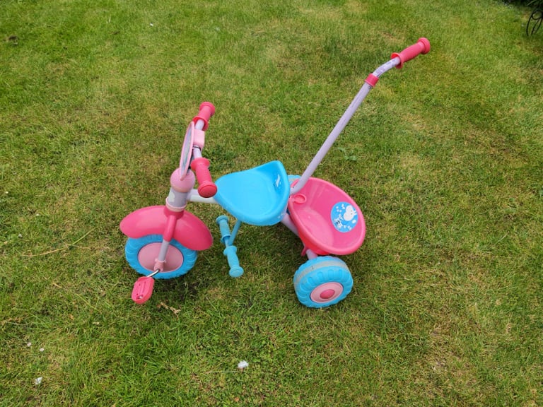 Peppa Pig Tricycle with push along detachable handle.