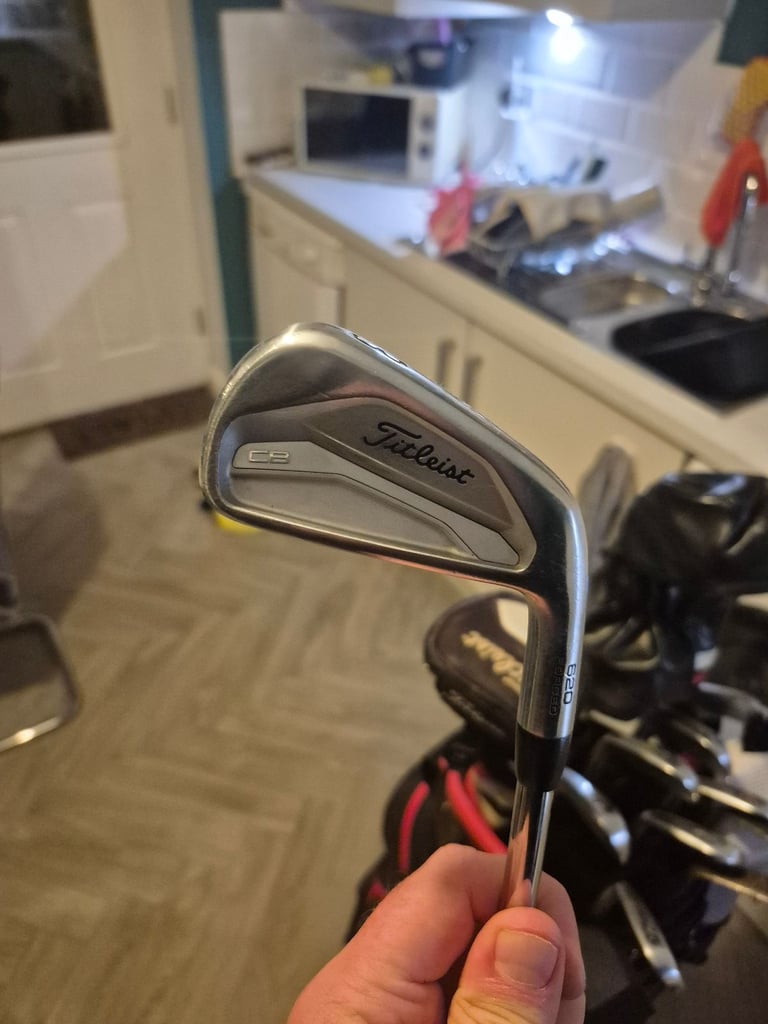 Full set titleist irons,driver, 3 wood, hybrid, mizuno rusty wedges and titleist bag 