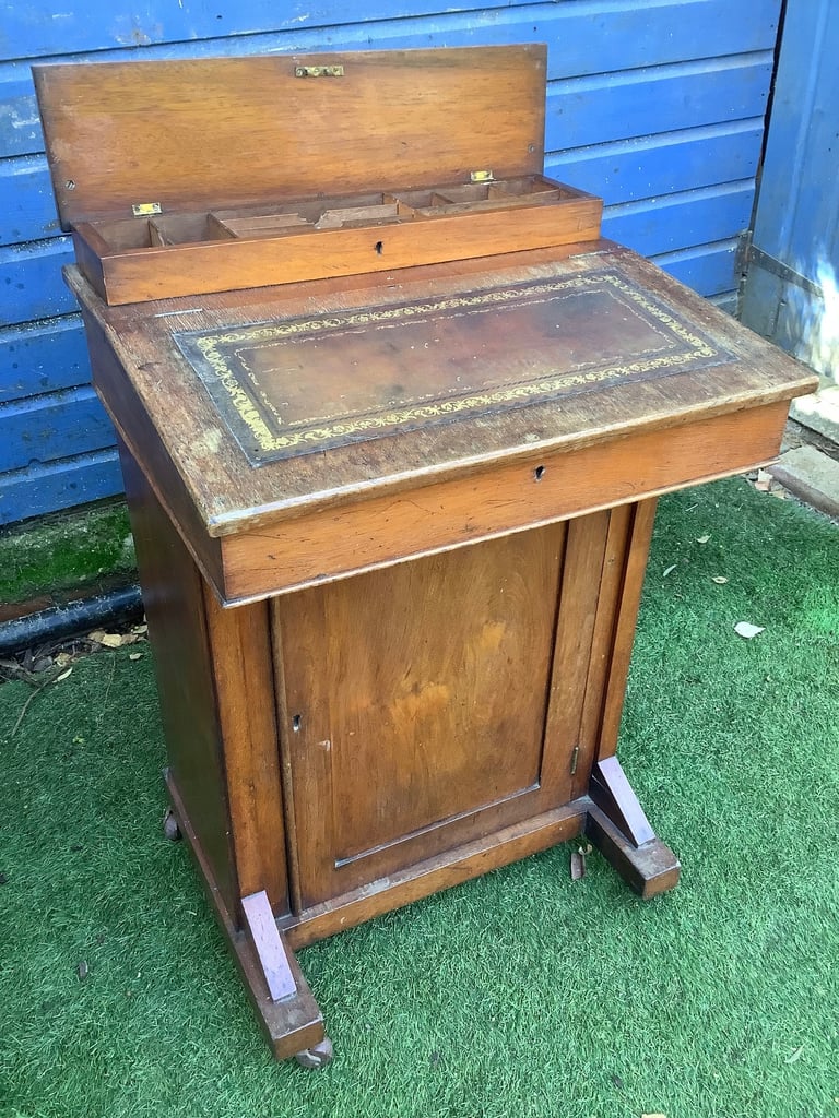 Victorian walnut brown leather insert davenport with ink wells & wheel castors