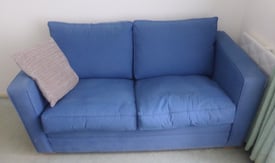 Blue upholstered sofa-bed