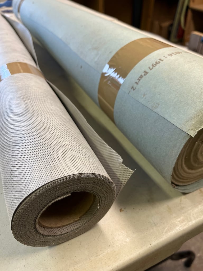 Rolls of building paper and vapour barrier