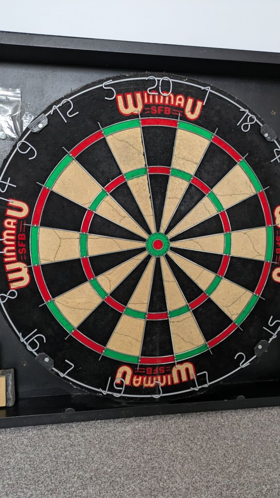 Vintage 1980's Winmau dartboard and Wooden cabinet with 3 sets of darts