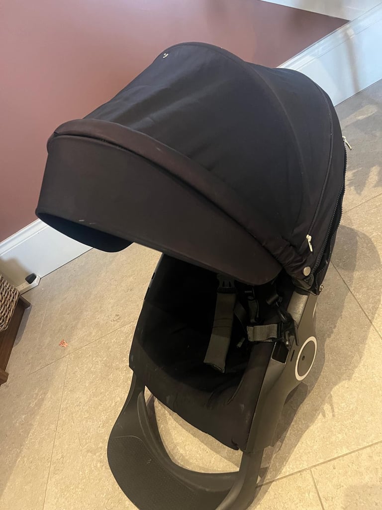  stokke transport system complete with carrycot and adjustable stroller seat black with spot trim