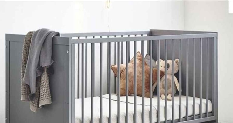 image for Grey cot and mattress 