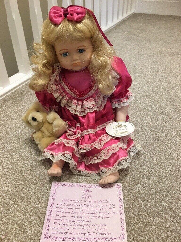 Leonardo porcelain sitting doll