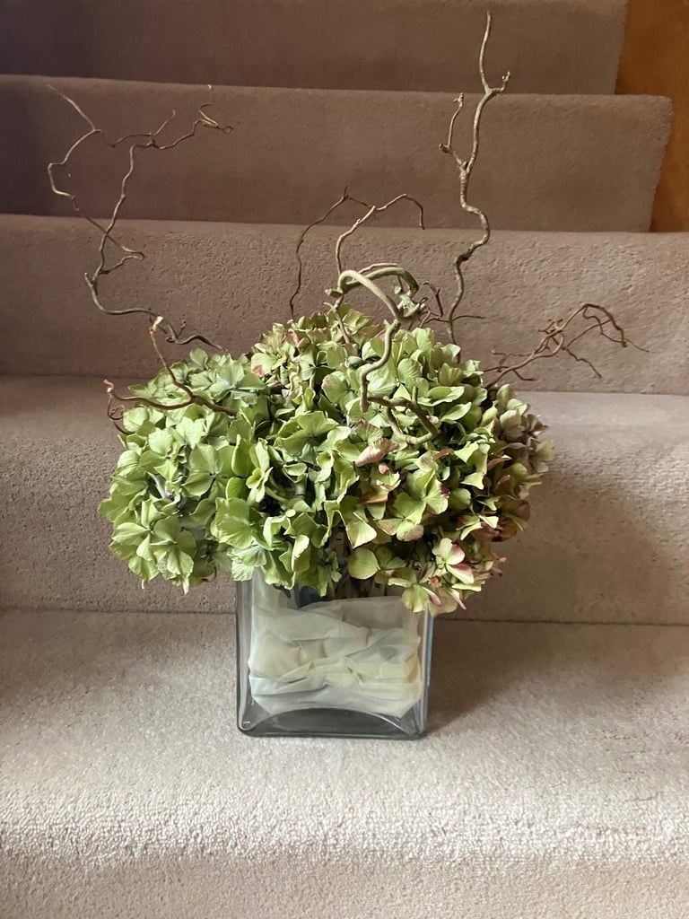 image for Glass vase with dried Hydrangeas and Corkscrew Hazel. Collect Fulham