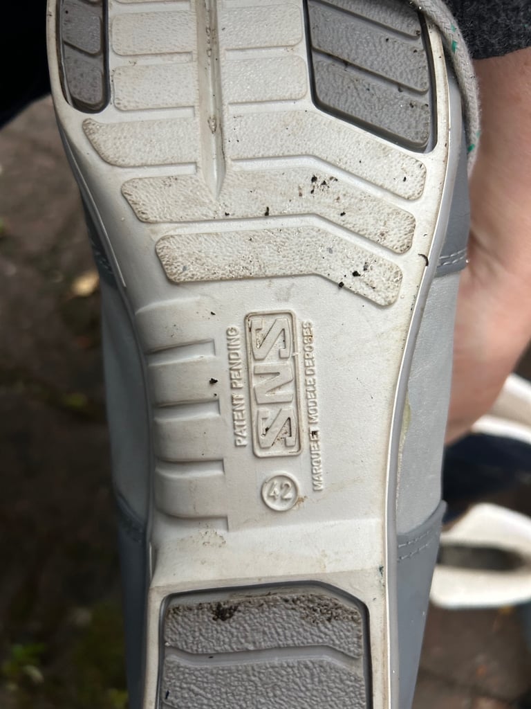 Various cross country skis, poles and boots