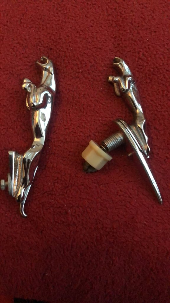 Vintage Jaguar car leaper emblems