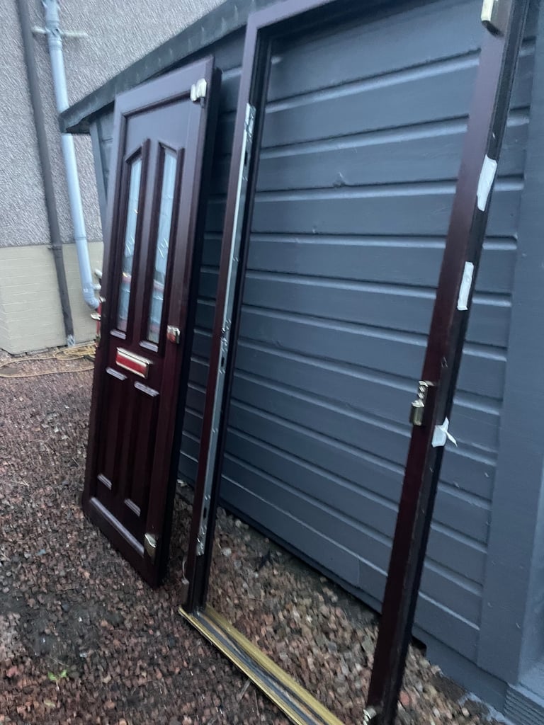 Upvc front door in rosewood 