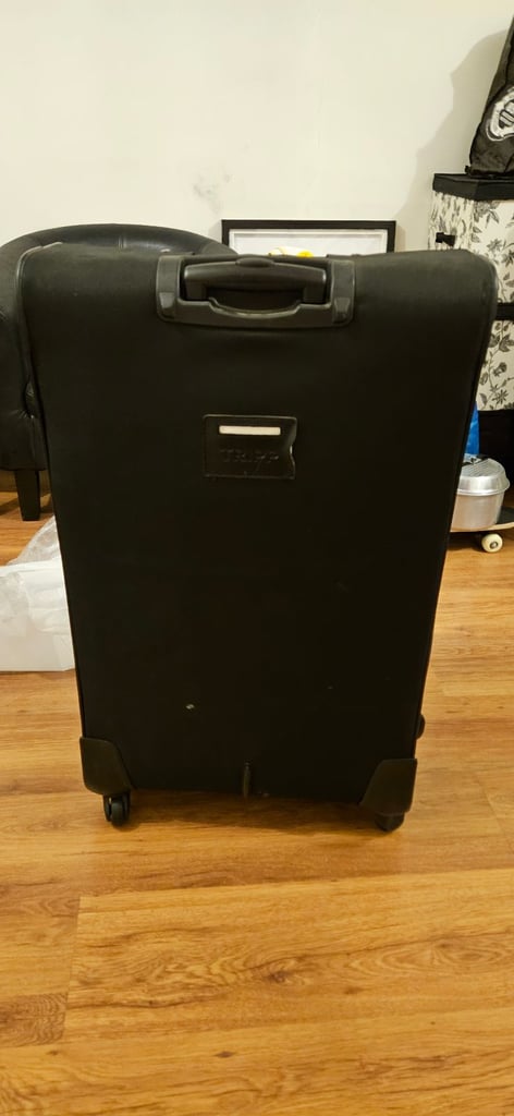 Trip LARGE Suitcase with extra small bag.