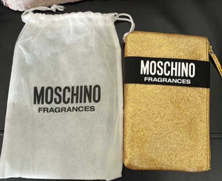 Unused moschino make up bag in gold