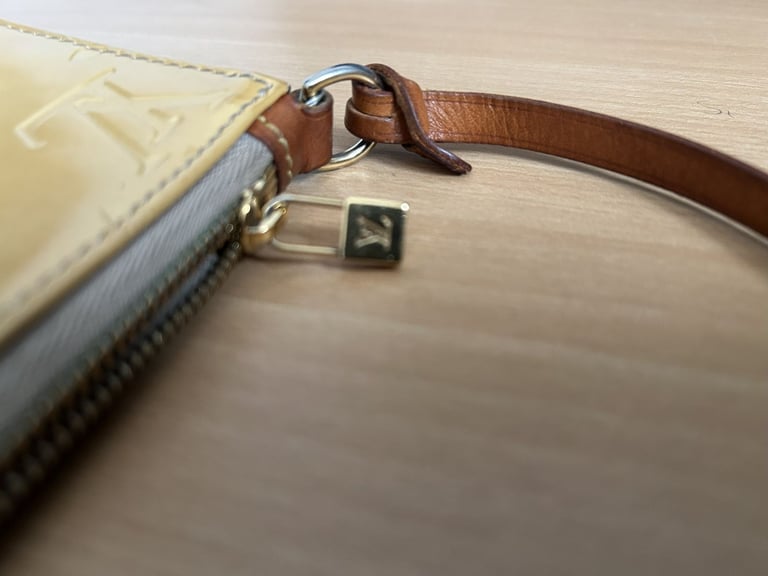 Louis Vuitton Beige Monogram Beige Remix Pochette Lexington handbag.