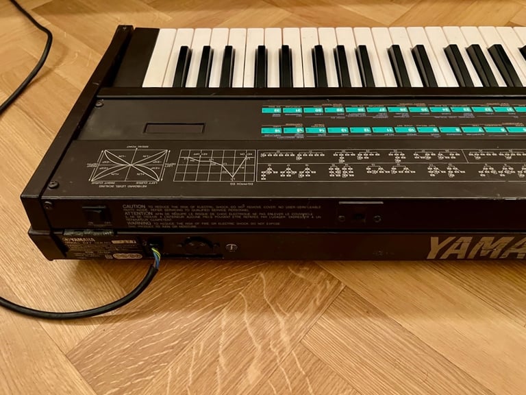 Yamaha DX7 Synthesizer Mk1 with original stand, soft case and manual.