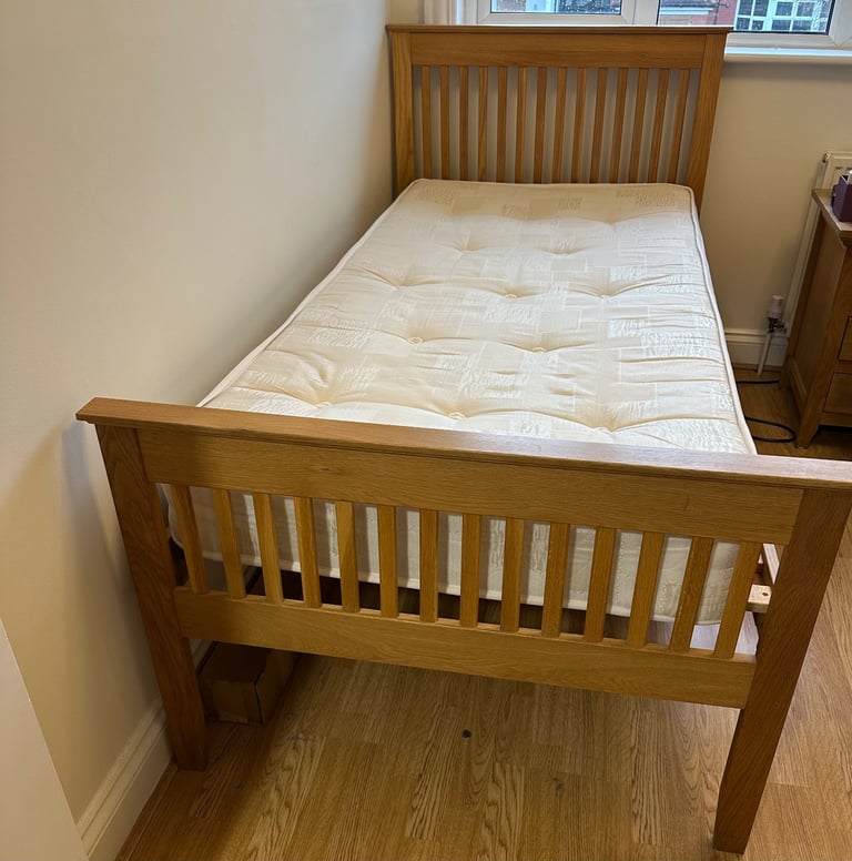 Single wooden bed with mattress