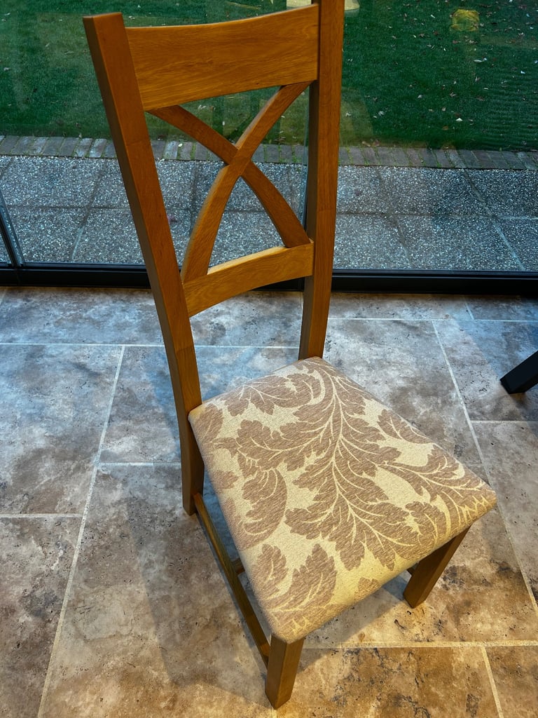 Solid oak dining table and six chairs