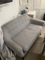 Two seater grey fabric sofa