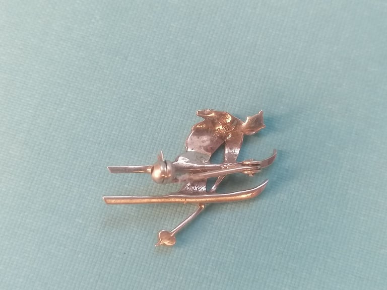 VINTAGE Brooch. Skier in mid - jump. 800  silver brooch. (missing one part as seen).