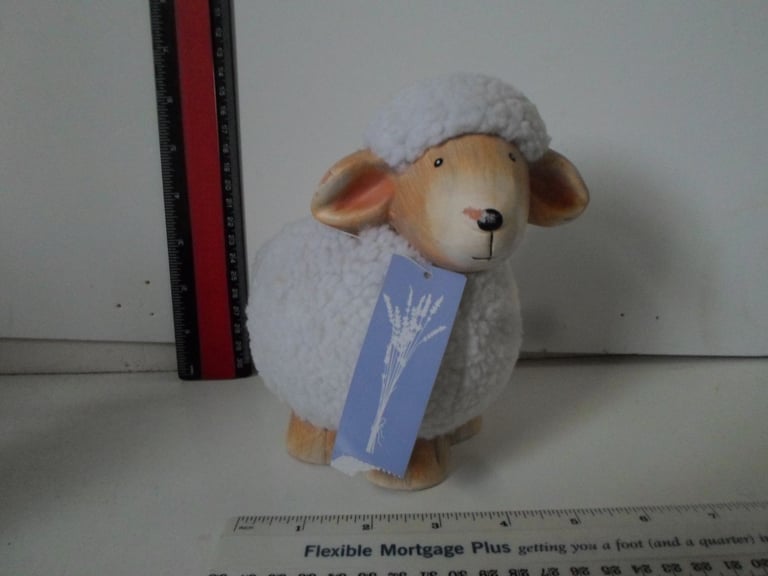 sheep money box ceramic with fleece covering 6 inches by 6 inches