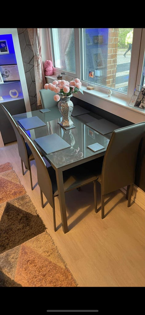 image for Dining table and 4 leather chairs 