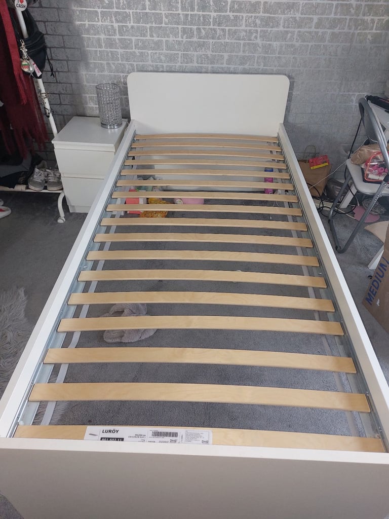 Single bed in white colour with bedside 
