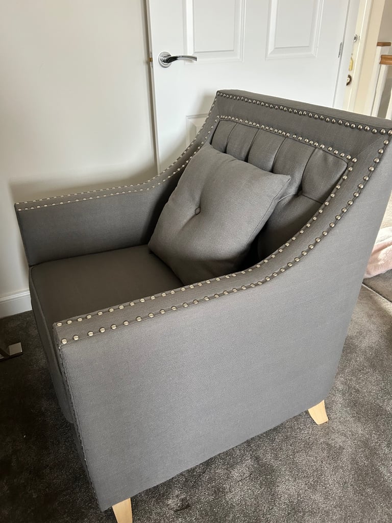 Grey studded armchair