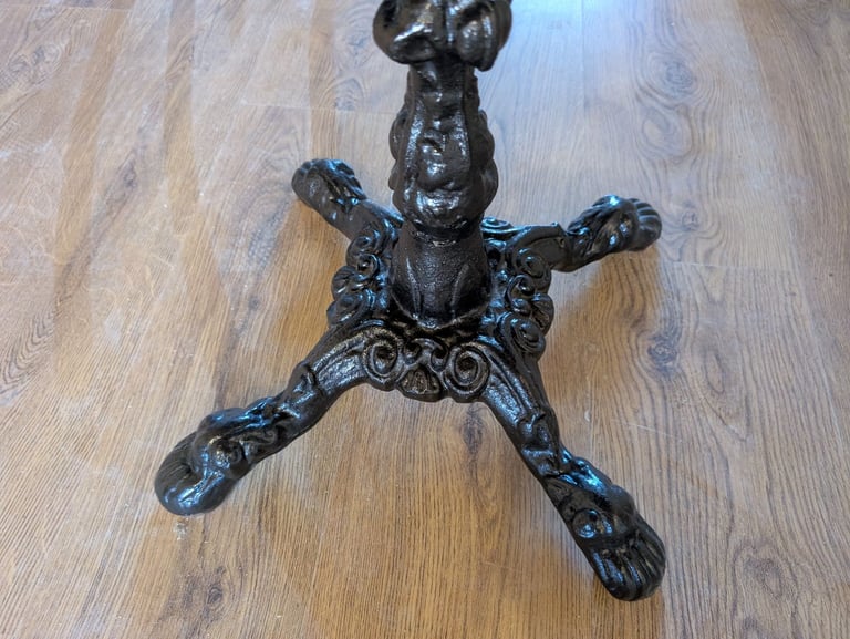 Solid Oak dinner table with cast iron base