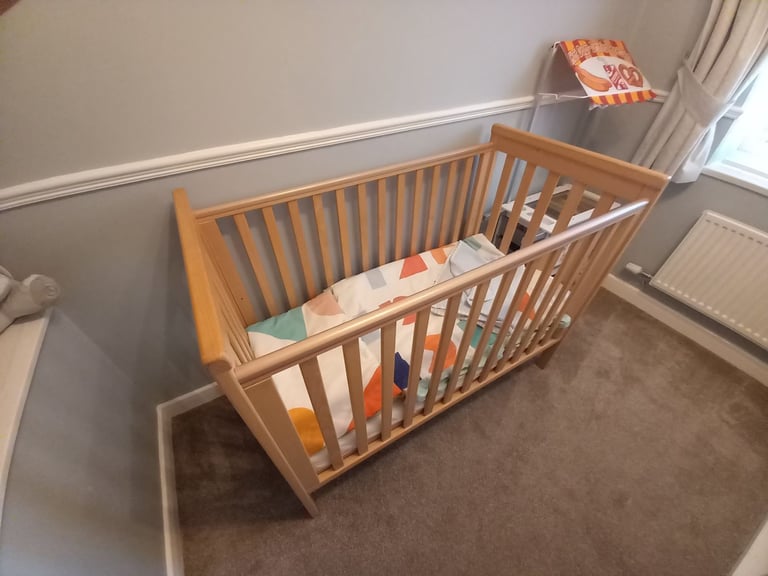 image for Baby cot, light oak. Excellent condition, like new,includes matress and bedding