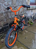 Kids bike - orange and black - size 16