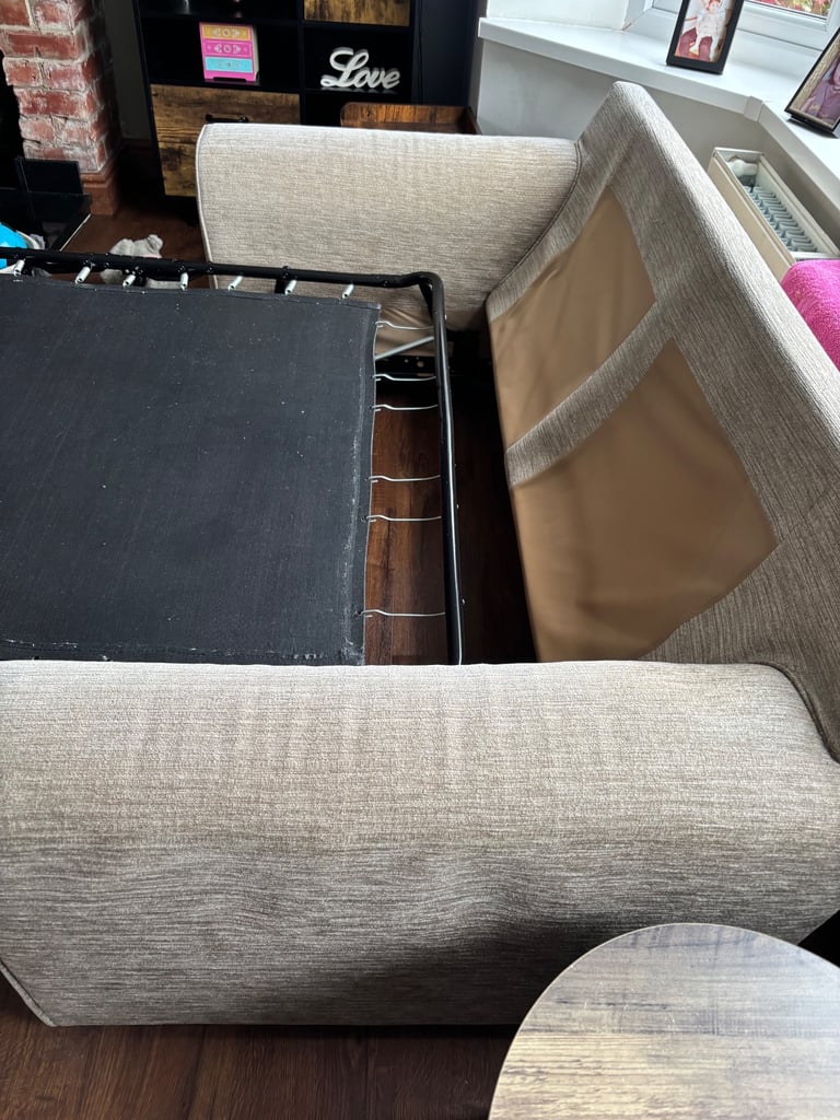 Beige sofa bed.