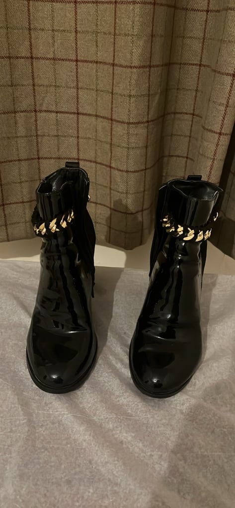 image for River Island black leather chain detail ankle boots. unicorn pic means its still available 🦄 