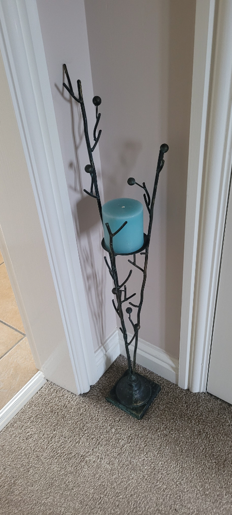 Metal iron decorative candlestick. Black with gold and blue