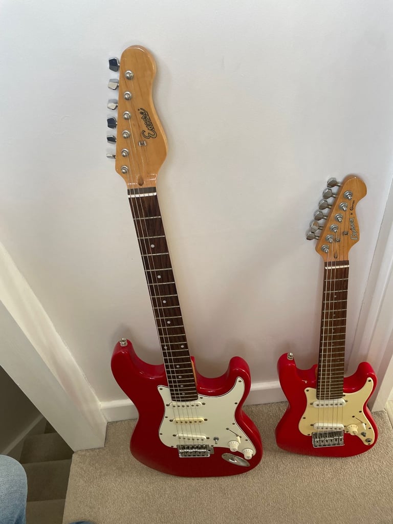 image for Two Fender Strat copy guitars. Child and adult sizes